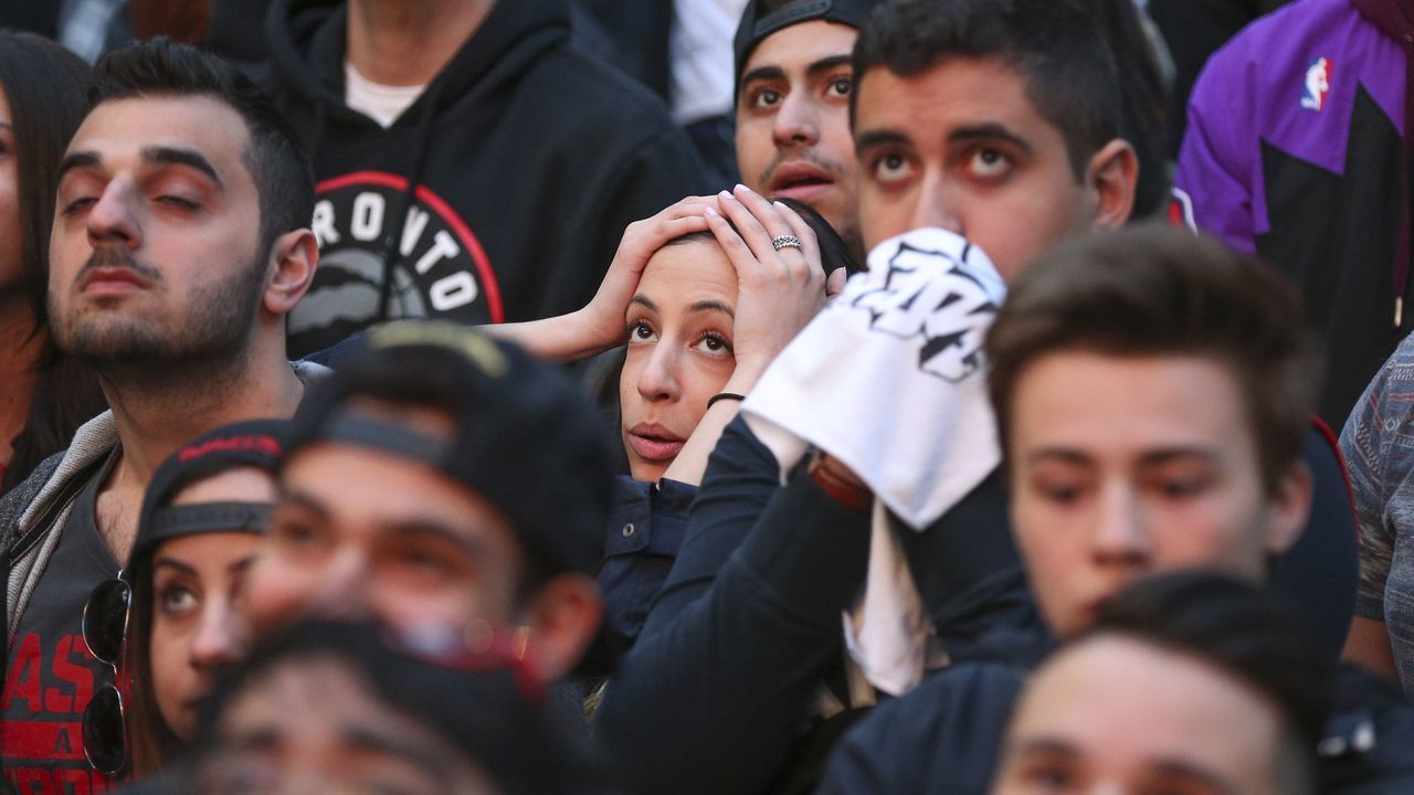 TORONTO, ON - MAY, 3 Some unhappy fans as the game takes a turn for the worse. Raptor Fans came out to Jurassic Park (Maple Leaf Square) outside of the Air Canada Centre to watch game 1 of the second round of NBA playoffs between the Miami Heat and the Toronto Raptors. (Richard Lautens/Toronto Star via Getty Images)