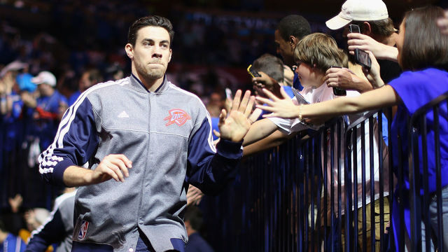 OKLAHOMA CITY, OK - APRIL 21: Nick Collison #4 of the Oklahoma City Thunder high-fives fans as he runs out onto the court before Game One of the Western Conference Quarterfinals of the 2013 NBA Playoffs against the Houston Rockets at Chesapeake Energy Arena on April 21, 2013 in Oklahoma City, Oklahoma. The Thunder defeated the Rockets 120-91.