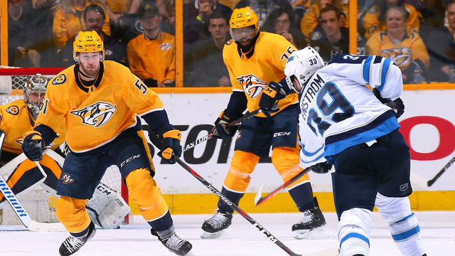NASHVILLE, TN - MAY 05: Toby Enstrom #39 of the Winnipeg Jets takes a shot toward Austin Watson #51 nas P.K. Subban #76 of the Nashville Predators during the first period of Game Five of the Western Conference Second Round during the 2018 NHL Stanley Cup Playoffs at Bridgestone Arena on May 5, 2018 in Nashville, Tennessee.