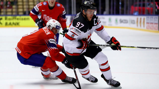 HERNING, DENMARK - MAY 10: Johannes Johannesen (L) of Norway and Connor McDavid of Canada battle for the puck during the 2018 IIHF Ice Hockey World Championship Group B game between Norway and Canada at Jyske Bank Boxen on May 10, 2018 in Herning, Denmark.