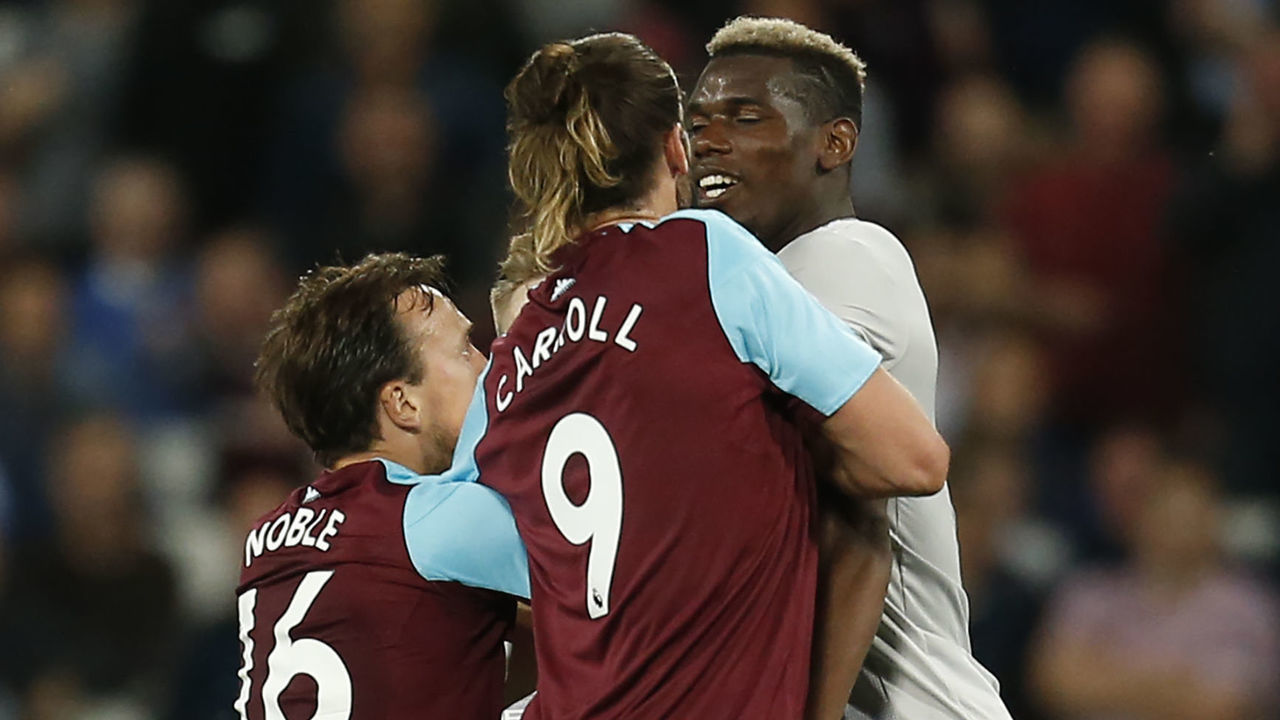 West Ham United's English midfielder Mark Noble (L) remonstrates with Manchester United's French midfielder Paul Pogba (R) after he was fouled by him during the English Premier League football match between West Ham United and Manchester United at The London Stadium, in east London on May 10, 2018.
