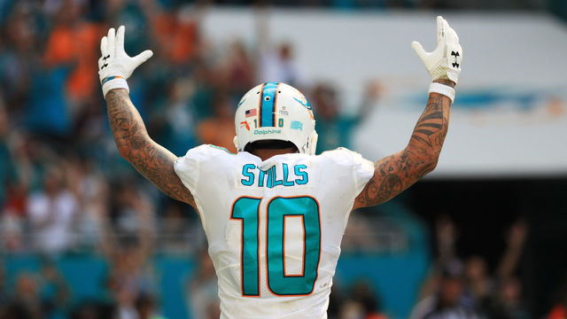 MIAMI GARDENS, FL - OCTOBER 08: Kenny Stills #10 of the Miami Dolphins celebrates a touchdown by Jarvis Landry #14 in the fourth quarter against the Tennessee Titans on October 8, 2017 at Hard Rock Stadium in Miami Gardens, Florida.