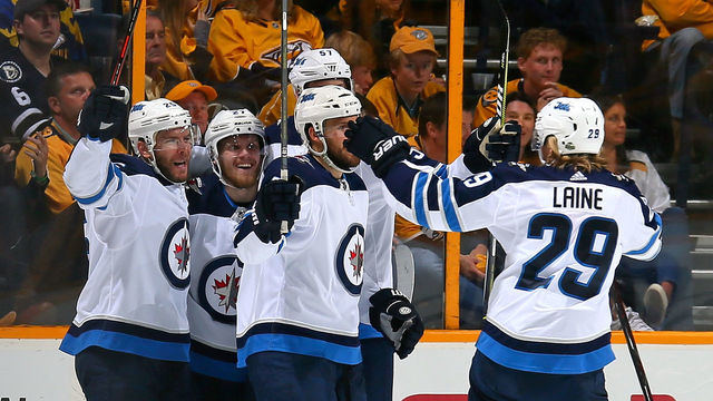 NASHVILLE, TN - MAY 10: Paul Stastny #25, Nikolaj Ehlers #27, Tyler Myers #57, and Patrik Laine #29 celebrate a goal against the Nashville Predators during the first period in Game Seven of the Western Conference Second Round during the 2018 NHL Stanley Cup Playoffs at Bridgestone Arena on May 10, 2018 in Nashville, Tennessee.