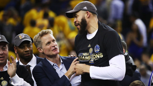 OAKLAND, CA - JUNE 12: Steve Kerr and JaVale McGee #1 of the Golden State Warriors celebrate after defeating the Cleveland Cavaliers 129-120 in Game 5 to win the 2017 NBA Finals at ORACLE Arena on June 12, 2017 in Oakland, California.