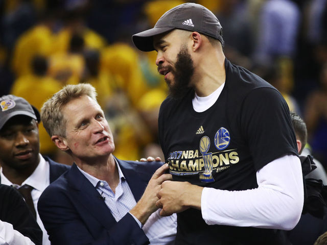 OAKLAND, CA - JUNE 12: Steve Kerr and JaVale McGee #1 of the Golden State Warriors celebrate after defeating the Cleveland Cavaliers 129-120 in Game 5 to win the 2017 NBA Finals at ORACLE Arena on June 12, 2017 in Oakland, California.