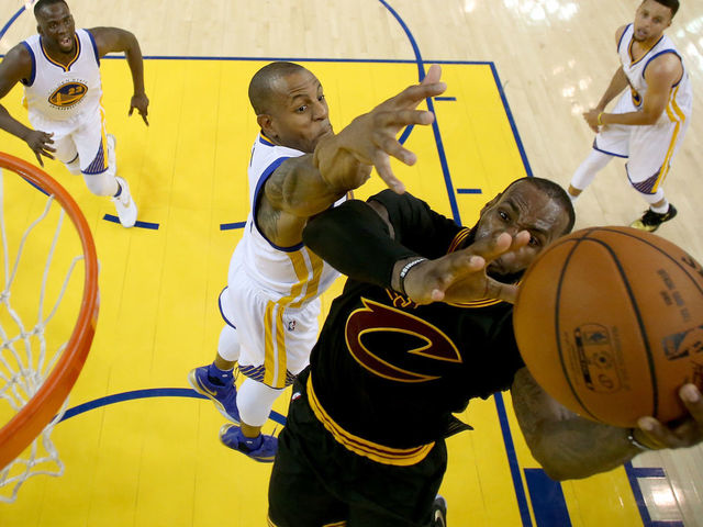 OAKLAND, CA - JUNE 19: Andre Iguodala #9 of the Golden State Warriors defends LeBron James #23 of the Cleveland Cavaliers in Game 7 of the 2016 NBA Finals at ORACLE Arena on June 19, 2016 in Oakland, California.