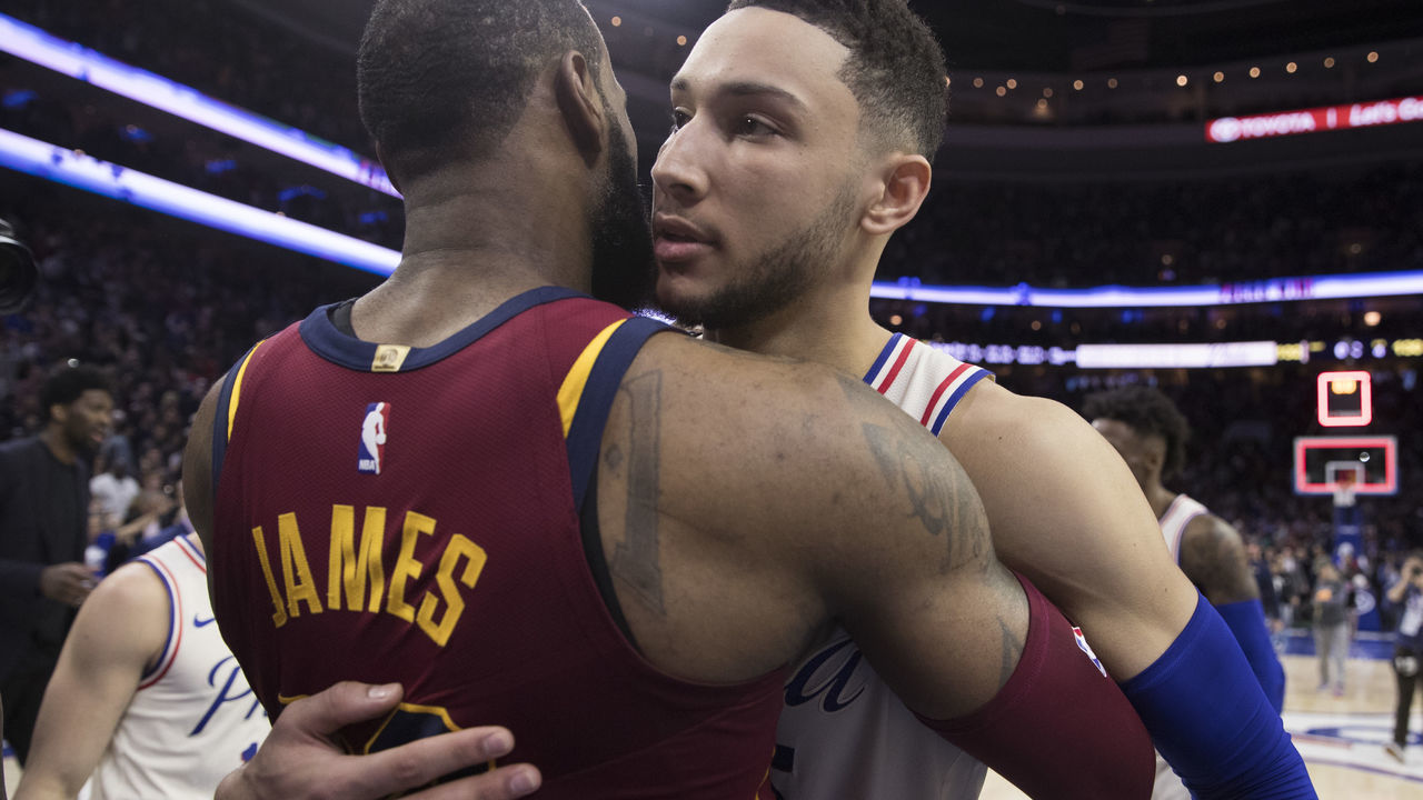 PHILADELPHIA, PA - APRIL 6: LeBron James #23 of the Cleveland Cavaliers hugs Ben Simmons #25 of the Philadelphia 76ers after the game at the Wells Fargo Center on April 6, 2018 in Philadelphia, Pennsylvania. The 76ers defeated the Cavaliers 132-130.