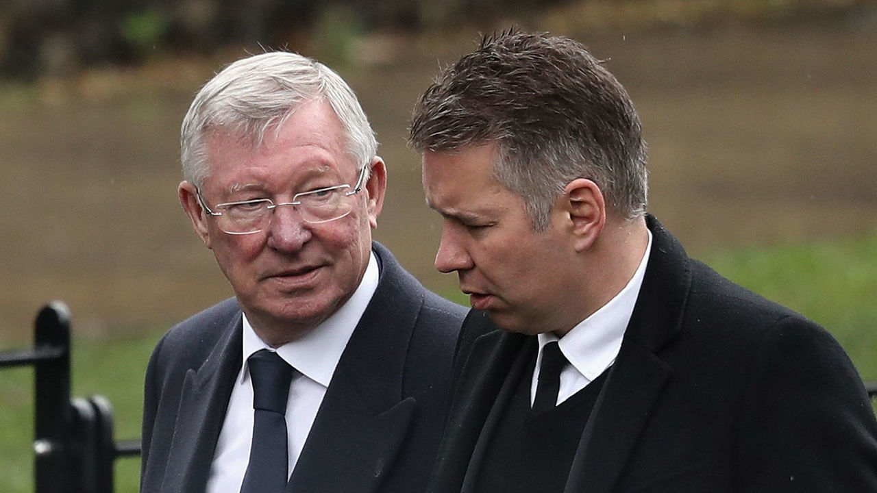 WATFORD, ENGLAND - FEBRUARY 01: Sir Alex Ferguson (L) and Darren Ferguson arrive to the funeral of former England football manager Graham Taylor at St Mary's Church on February 1, 2017 in Watford, England. Graham Taylor died on January 12, 2017 from a suspected heart attack. Graham Taylor was the England Football Team Manager from 1990 to 1993 having previously played for Scunthorpe United, Grimsby Town and Lincoln City. Later Watford owner, Elton John, hired him to manage the club and he brought them from the 4th Division to the First Division. He died on January 12, 2017 of a suspected heart attack and leaves a wife and two daughters.