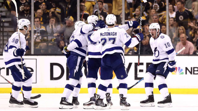 BOSTON, MA - MAY 4: Steven Stamkos #91 of the Tampa Bay Lightning celebrates with J.T. Miller #10, Mikhail Sergachev #98 and Ryan McDonagh #27 after scoring against the Boston Bruins during the third period of Game Four of the Eastern Conference Second Round during the 2018 NHL Stanley Cup Playoffs at TD Garden on May 4, 2018 in Boston, Massachusetts.