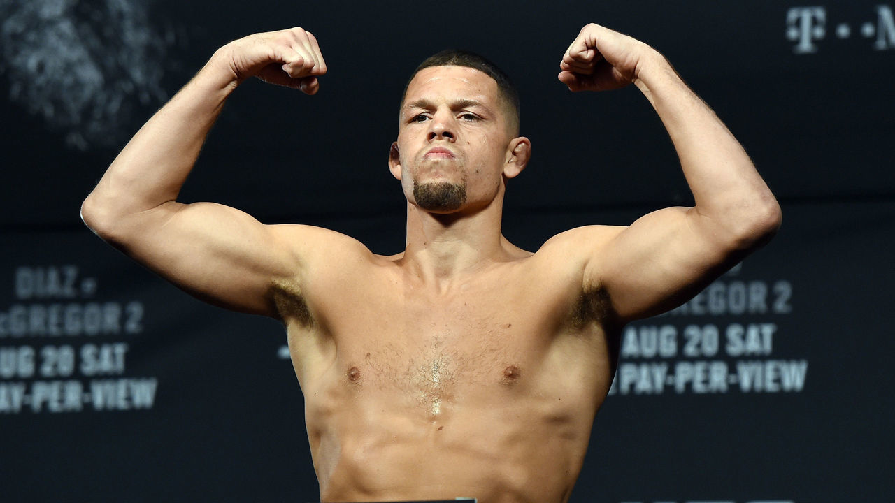 LAS VEGAS, NV - AUGUST 19: Mixed martial artist Nate Diaz poses on the scale during his weigh-in for UFC 202 at MGM Grand Conference Center on August 19, 2016 in Las Vegas, Nevada. McGregor will meet UFC featherweight champion Conor McGregor in a welterweight rematch on August 20, 2016, at T-Mobile Arena in Las Vegas.