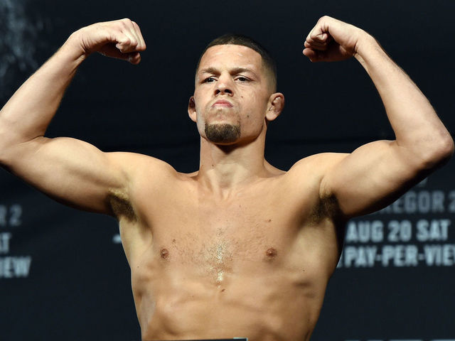 LAS VEGAS, NV - AUGUST 19: Mixed martial artist Nate Diaz poses on the scale during his weigh-in for UFC 202 at MGM Grand Conference Center on August 19, 2016 in Las Vegas, Nevada. McGregor will meet UFC featherweight champion Conor McGregor in a welterweight rematch on August 20, 2016, at T-Mobile Arena in Las Vegas.