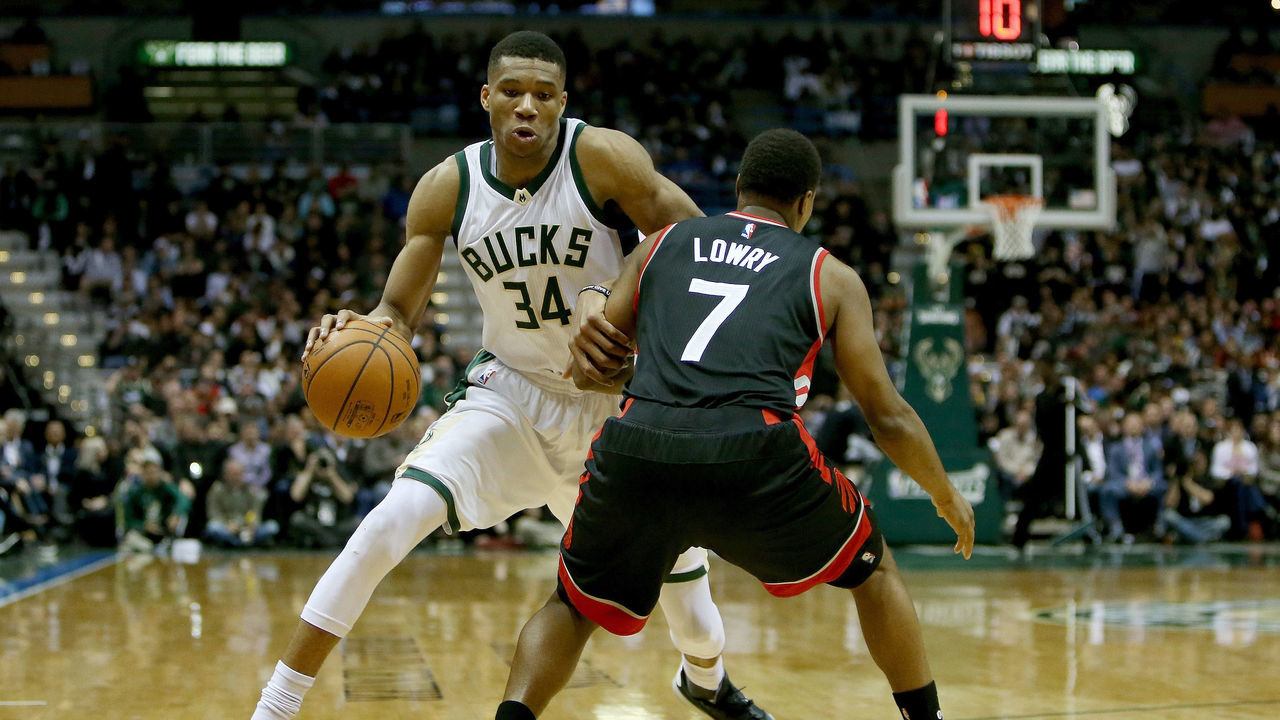 MILWAUKEE, WI - APRIL 27: Giannis Antetokounmpo #34 of the Milwaukee Bucks dribbles the ball while being guarded by Kyle Lowry #7 of the Toronto Raptors in the second quarter in Game Six of the Eastern Conference Quarterfinals during the 2017 NBA Playoffs at BMO Harris Bradley Center on April 27, 2017 in Milwaukee, Wisconsin.