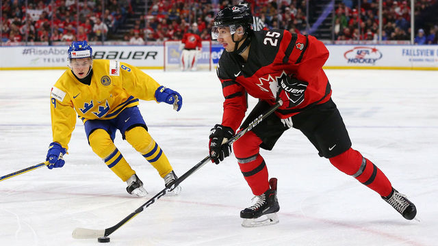 BUFFALO, NY - JANUARY 5: Jordan Kyrou #25 of Canada with the puck as Tim Soderlund #9 of Sweden defends during the Gold medal game of the IIHF World Junior Championship at KeyBank Center on January 5, 2018 in Buffalo, New York.