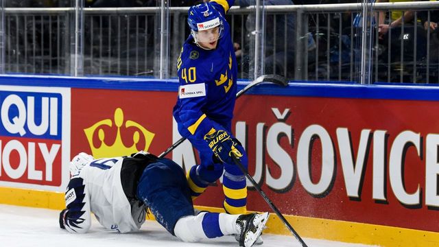 France's Florian Chakiachvili falls after a hit by Sweden's Elias Pettersson (R) during the group A match Sweden vs France of the 2018 IIHF Ice Hockey World Championship at the Royal Arena in Copenhagen, Denmark, on May 7, 2018.