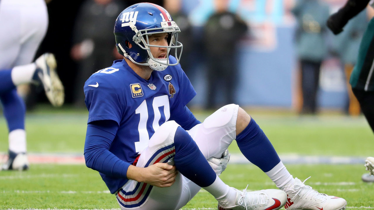 EAST RUTHERFORD, NJ - DECEMBER 17: Eli Manning #10 of the New York Giants lays on the ground after a play against the Philadelphia Eagles during the second quarter in the game at MetLife Stadium on December 17, 2017 in East Rutherford, New Jersey.