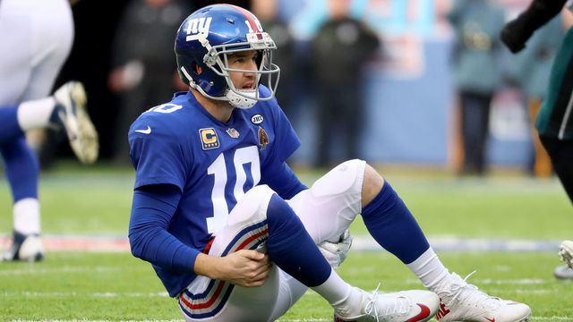 EAST RUTHERFORD, NJ - DECEMBER 17: Eli Manning #10 of the New York Giants lays on the ground after a play against the Philadelphia Eagles during the second quarter in the game at MetLife Stadium on December 17, 2017 in East Rutherford, New Jersey.
