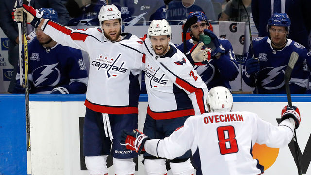 TAMPA, FL - MAY 13: Tom Wilson #43 of the Washington Capitals celebrates with Matt Niskanen #2 and Alex Ovechkin #8 after scoring a goal against Andrei Vasilevskiy #88 of the Tampa Bay Lightning during the first period in Game Two of the Eastern Conference Finals during the 2018 NHL Stanley Cup Playoffs at Amalie Arena on May 13, 2018 in Tampa, Florida.
