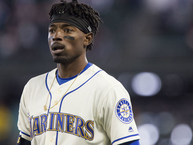 SEATTLE, WA - APRIL 15: Dee Gordon #9 of the Seattle Mariners reacts to being called out at first on a bunt, which was reviewed and upheld, during the ninth inning against the Oakland Athletics at Safeco Field on April 15, 2018 in Seattle, Washington. All players are wearing #42 in honor of Jackie Robinson Day.