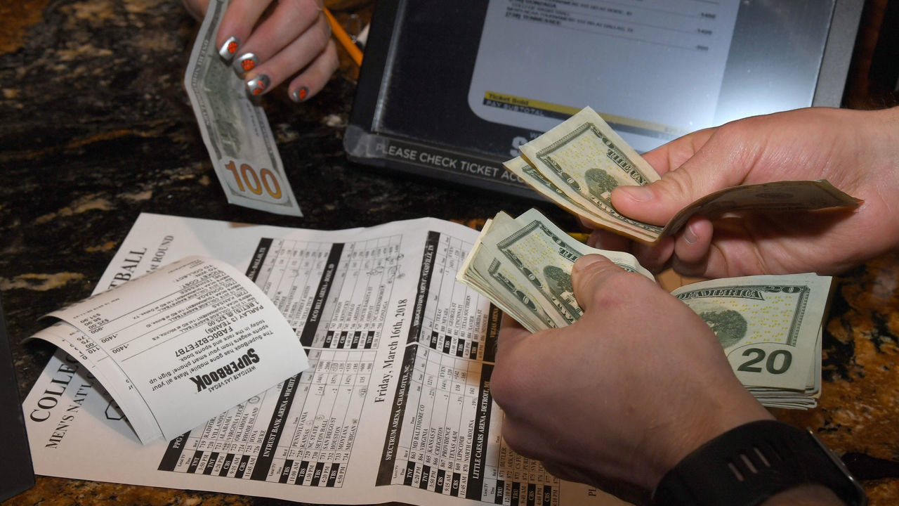 LAS VEGAS, NV - MARCH 15: Jake Sindberg of Wisconsin makes bets during a viewing party for the NCAA Men's College Basketball Tournament inside the 25,000-square-foot Race & Sports SuperBook at the Westgate Las Vegas Resort & Casino which features 4,488-square-feet of HD video screens on March 15, 2018 in Las Vegas, Nevada.