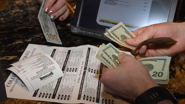 LAS VEGAS, NV - MARCH 15: Jake Sindberg of Wisconsin makes bets during a viewing party for the NCAA Men's College Basketball Tournament inside the 25,000-square-foot Race & Sports SuperBook at the Westgate Las Vegas Resort & Casino which features 4,488-square-feet of HD video screens on March 15, 2018 in Las Vegas, Nevada.