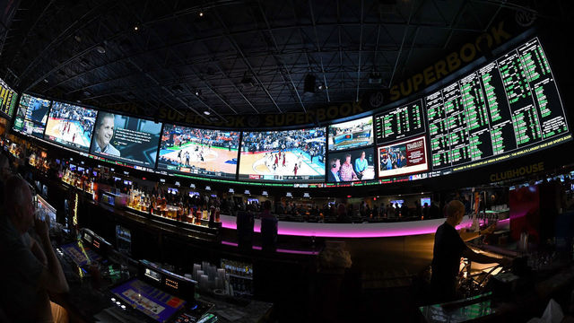 LAS VEGAS, NV - MARCH 15: (EDITORS NOTE: This image was shot with a fisheye lens.) Guests attend a viewing party for the NCAA Men's College Basketball Tournament inside the 25,000-square-foot Race & Sports SuperBook at the Westgate Las Vegas Resort & Casino which features 4,488-square-feet of HD video screens on March 15, 2018 in Las Vegas, Nevada.