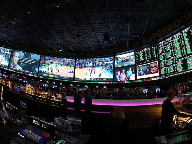 LAS VEGAS, NV - MARCH 15: (EDITORS NOTE: This image was shot with a fisheye lens.) Guests attend a viewing party for the NCAA Men's College Basketball Tournament inside the 25,000-square-foot Race & Sports SuperBook at the Westgate Las Vegas Resort & Casino which features 4,488-square-feet of HD video screens on March 15, 2018 in Las Vegas, Nevada.