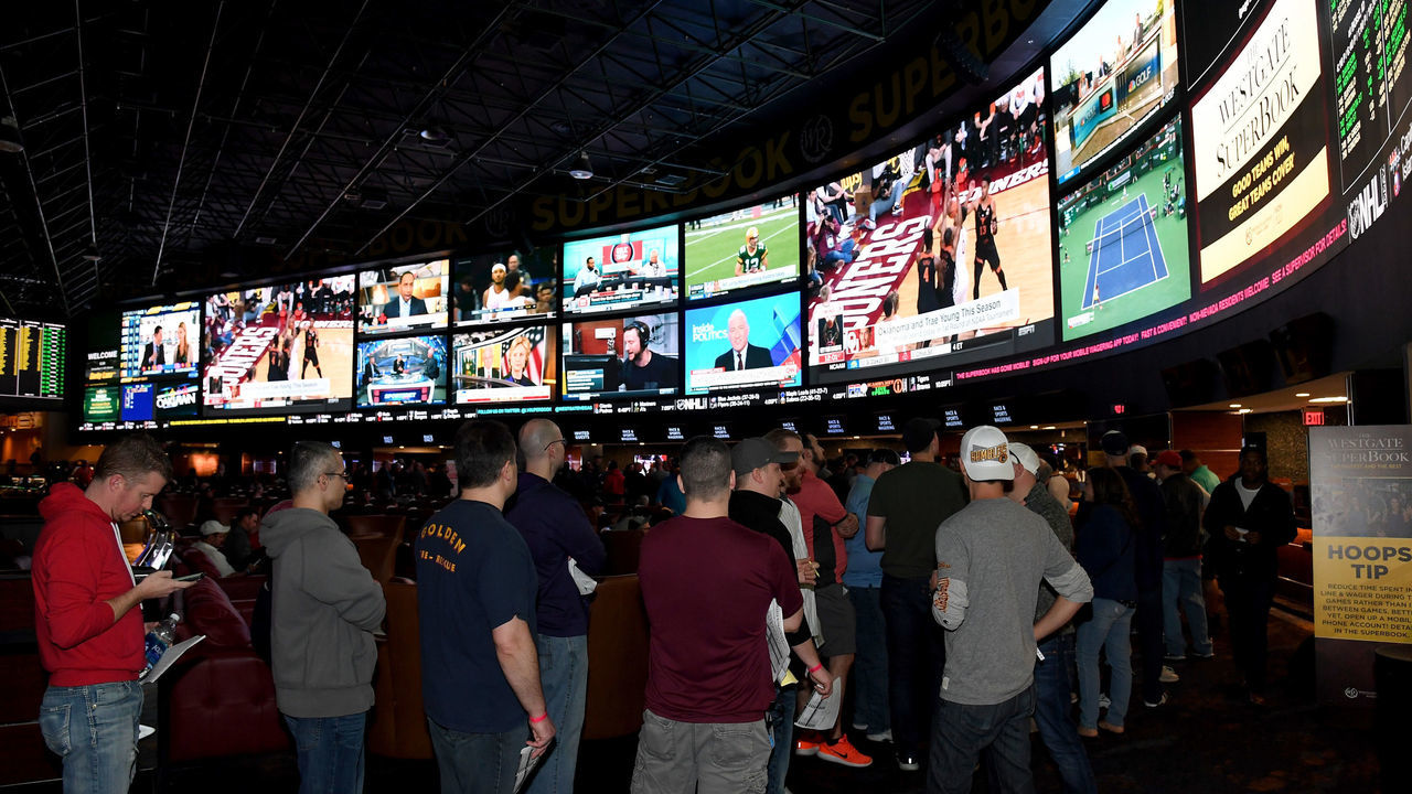LAS VEGAS, NV - MARCH 15: Guests line up to place bets as they attend a viewing party for the NCAA Men's College Basketball Tournament inside the 25,000-square-foot Race & Sports SuperBook at the Westgate Las Vegas Resort & Casino which features 4,488-square-feet of HD video screens on March 15, 2018 in Las Vegas, Nevada.