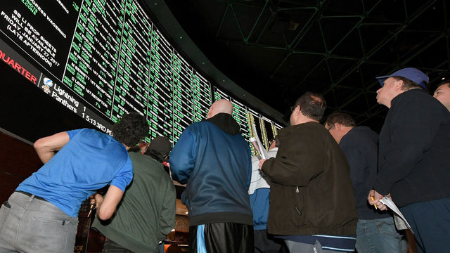 LAS VEGAS, NV - JANUARY 26: Bettors line up to place wagers after more than 400 proposition bets for Super Bowl LI between the Atlanta Falcons and the New England Patriots were posted at the Race & Sports SuperBook at the Westgate Las Vegas Resort & Casino on January 26, 2017 in Las Vegas, Nevada.