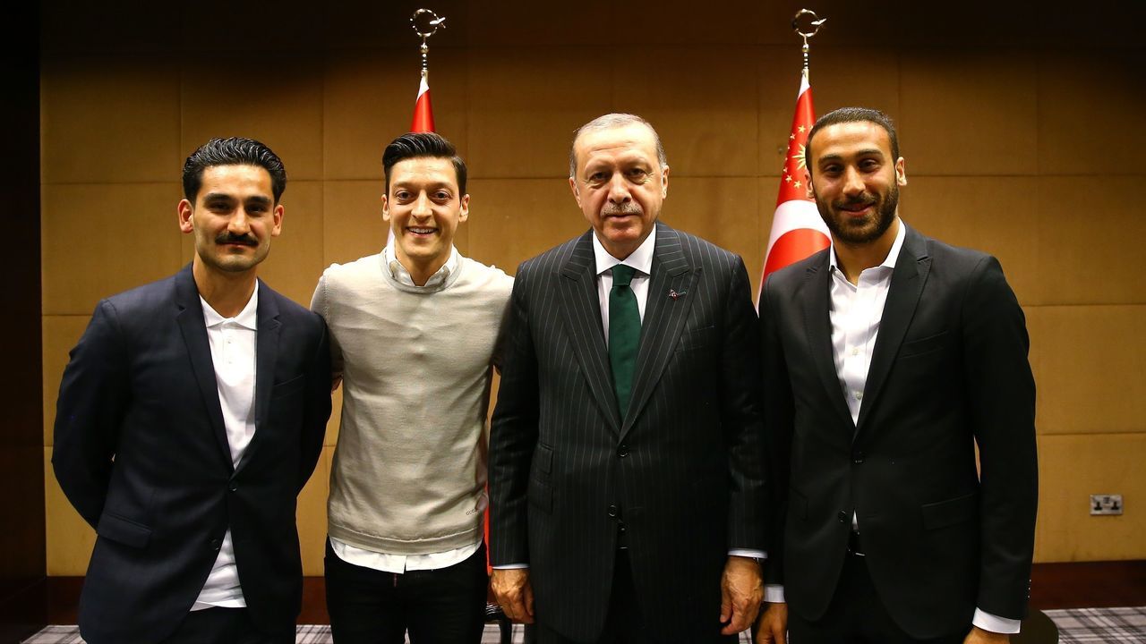 LONDON, UNITED KINGDOM - MAY 13: Turkish football players Ilkay Gundogan (L), Mesut Ozil (L-2) and Cenk Tosun (R) pose for a photo with Turkish President Recep Tayyip Erdogan (R-2) in London, United Kingdom on May 13, 2018.