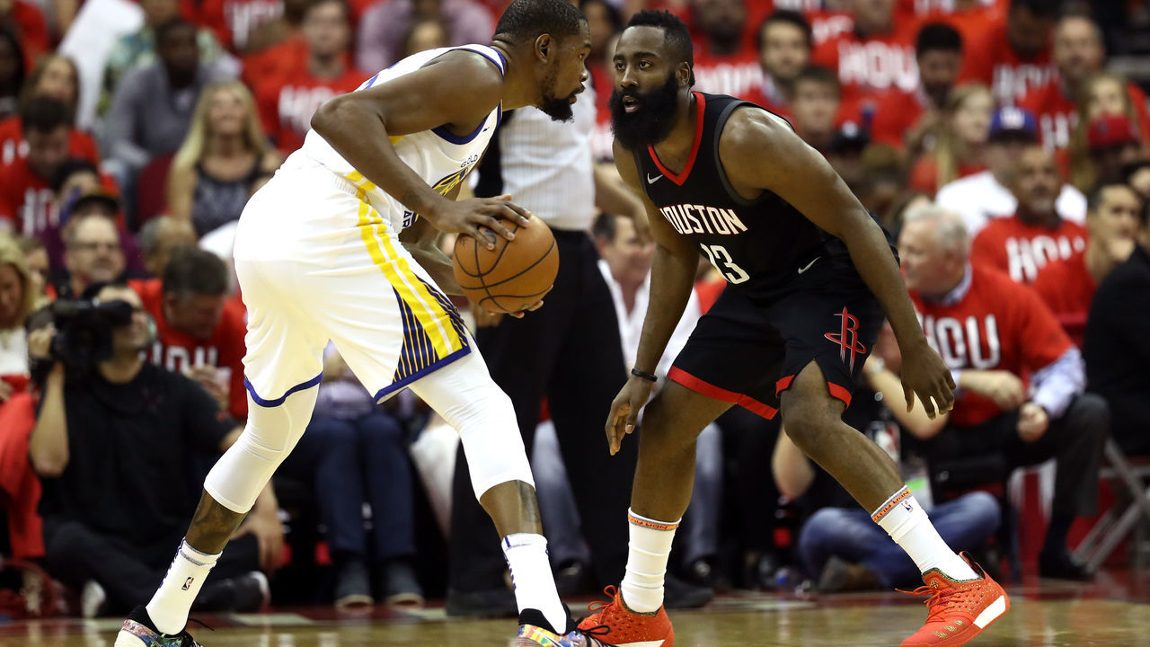 HOUSTON, TX - MAY 14: James Harden #13 of the Houston Rockets defends Kevin Durant #35 of the Golden State Warriors in the first half in Game One of the Western Conference Finals of the 2018 NBA Playoffs at Toyota Center on May 14, 2018 in Houston, Texas.