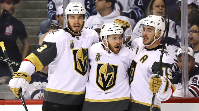 WINNIPEG, MB - MAY 14: Jonathan Marchessault #81 is congratulated by his teammates Brayden McNabb #3 and Reilly Smith #19 of the Vegas Golden Knights after scoring a first period goal against the Winnipeg Jets in Game Two of the Western Conference Finals during the 2018 NHL Stanley Cup Playoffs at Bell MTS Place on May 14, 2018 in Winnipeg, Canada.