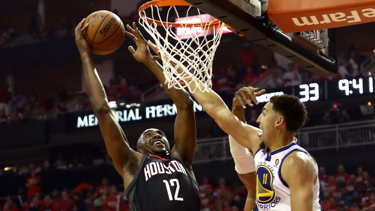 HOUSTON, TX - MAY 14: Luc Mbah a Moute #12 of the Houston Rockets drives to the basket against Klay Thompson #11 of the Golden State Warriors in the first half in Game One of the Western Conference Finals of the 2018 NBA Playoffs at Toyota Center on May 14, 2018 in Houston, Texas.