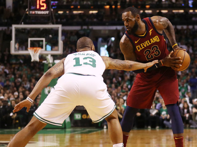 BOSTON, MA - MAY 13: LeBron James #23 of the Cleveland Cavaliers is defended by Marcus Morris #13 of the Boston Celtics during the first quarter in Game One of the Eastern Conference Finals of the 2018 NBA Playoffs at TD Garden on May 13, 2018 in Boston, Massachusetts.