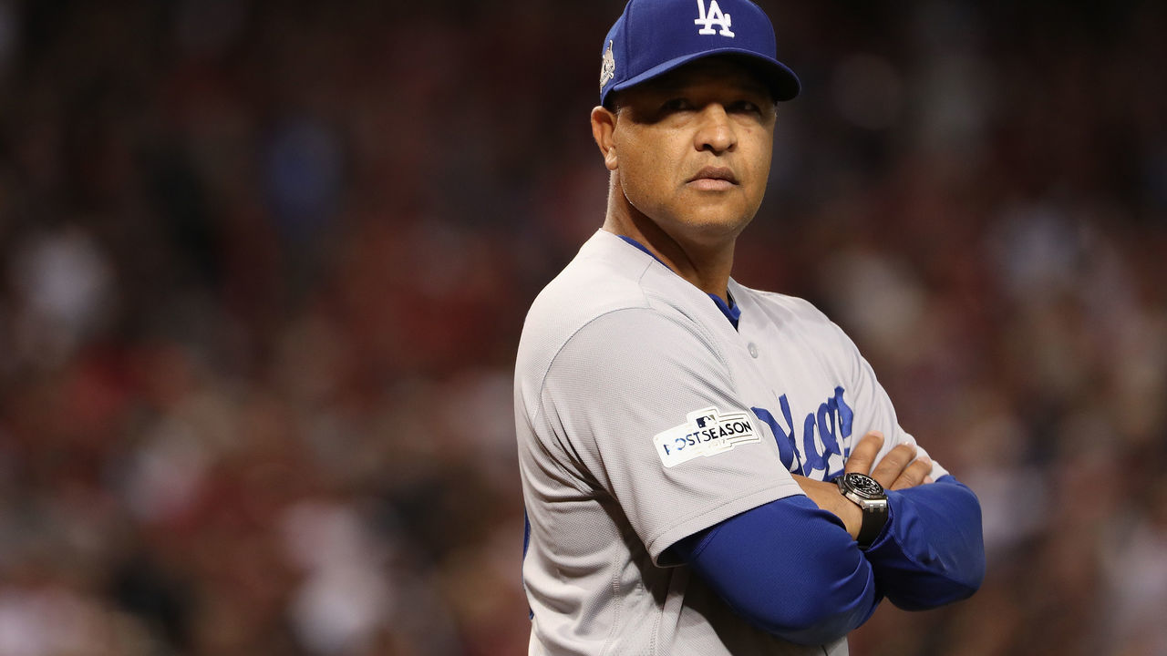PHOENIX, AZ - OCTOBER 09: Manager Dave Roberts #30 of the Los Angeles Dodgers looks on before the start of the National League Divisional Series game three against the Arizona Diamondbacks at Chase Field on October 9, 2017 in Phoenix, Arizona.