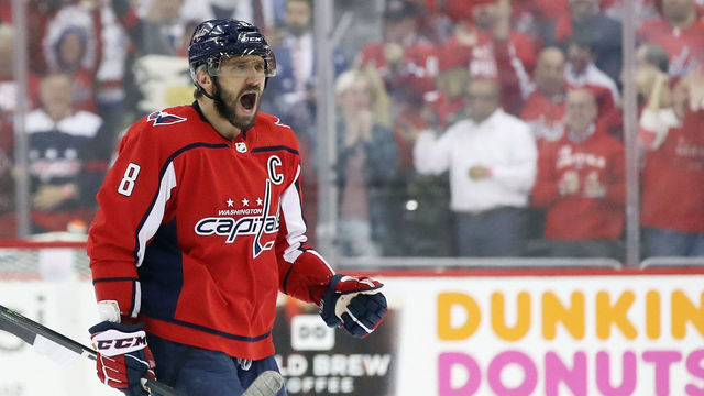 WASHINGTON, DC - APRIL 26: Alex Ovechkin #8 of the Washington Capitals celebrates a goal by Evgeny Kuznetsov #92 against the Pittsburgh Penguins in Game One of the Eastern Conference Second Round during the 2018 NHL Stanley Cup Playoffs at the Capital One Arena on April 26, 2018 in Washington, DC. The Penguins defeated the Capitals 3-2.