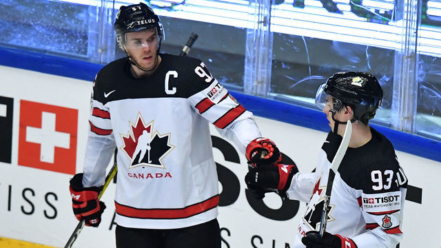 Canada's Connor McDavid and Ryan Nugent-Hopkins (R) celebrate after they scored during the group B match Canada v Germany of the 2018 IIHF Ice Hockey World Championship at the Jyske Bank Boxen in Herning, Denmark, on May 15, 2018.