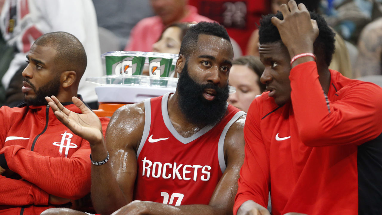 SAN ANTONIO,TX - APRIL 1 : James Harden #13 of the Houston Rockets talks with teammate Clint Capela #15 of the Houston Rockets while Chris Paul #3 of the Houston Rockets,L watches the game at AT&T Center on April 1 , 2018 in San Antonio, Texas. NOTE TO USER: User expressly acknowledges and agrees that , by downloading and or using this photograph, User is consenting to the terms and conditions of the Getty Images License Agreement.