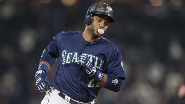 SEATTLE, WA - SEPTEMBER 30: Robinson Cano #22 of the Seattle Mariners rounds the bases after hitting a two-run home run that scored Norichika Aoki #8 of the Seattle Mariners off of starting pitcher Raul Alcantara #50 of the Oakland Athletics during the first inning of a game at Safeco Field on September 30, 2016 in Seattle, Washington.