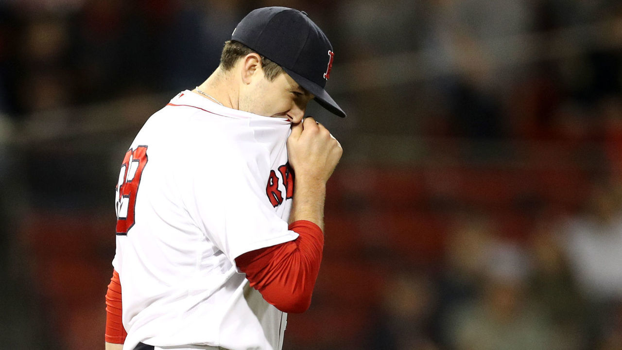 BOSTON, MA - MAY 14: Carson Smith #39 of the Boston Red Sox reacts after Khris Davis #2 of the Oakland Athletics hit a home run during the eighth inning at Fenway Park on May 14, 2018 in Boston, Massachusetts.