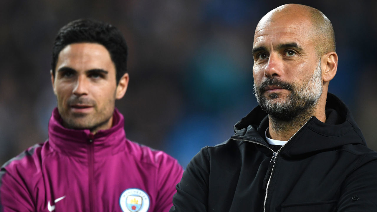 MANCHESTER, ENGLAND - MAY 09: Mikel Arteta and Josep Guardiola, Manager of Manchester City looks on during the Premier League match between Manchester City and Brighton and Hove Albion at Etihad Stadium on May 9, 2018 in Manchester, England.