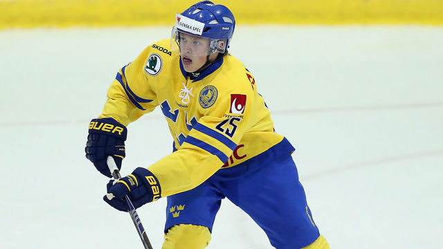 LAKE PLACID, NY - AUGUST 03: Lawrence Pilut #25 of Team Sweden skates against USA White during the 2014 USA Hockey Junior Evaluation Camp at the Lake Placid Olympic Center on August 3, 2014 in Lake Placid, New York.