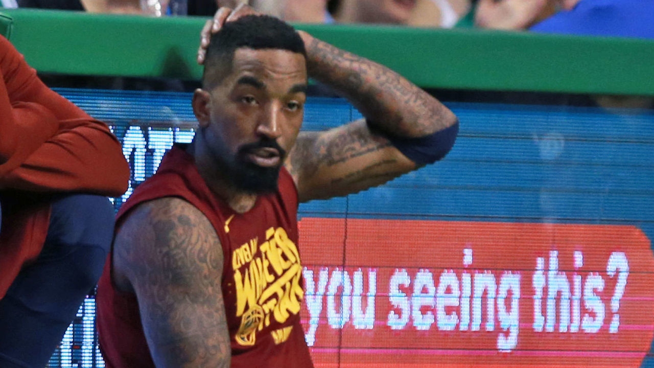 BOSTON, MA - MAY 13: The sign behind Cleveland Cavaliers J.R. Smith (far right) read 'You Seeing This', and the players on Cleveland's bench in the fourth quarter, including LeBron James (far left) were certainly seeing the Celtics dismantle their team in Game One. The Boston Celtics hosted the Cleveland Cavaliers for Game One of their NBA Eastern Conference Final Playoff series at TD Garden in Boston on May 13, 2018.