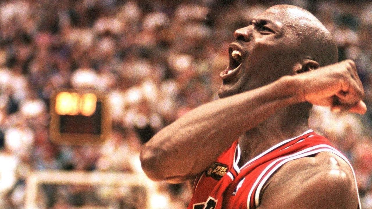 SALT LAKE CITY, UNITED STATES: Michael Jordan of the Chicago Bulls celebrates 14 June after winning game six of the NBA Finals against the Utah Jazz at the Delta Center in Salt Lake City, UT. The Bulls won the game 87-86 to win their sixth NBA Championship. AFP PHOTO/Robert SULLIVAN