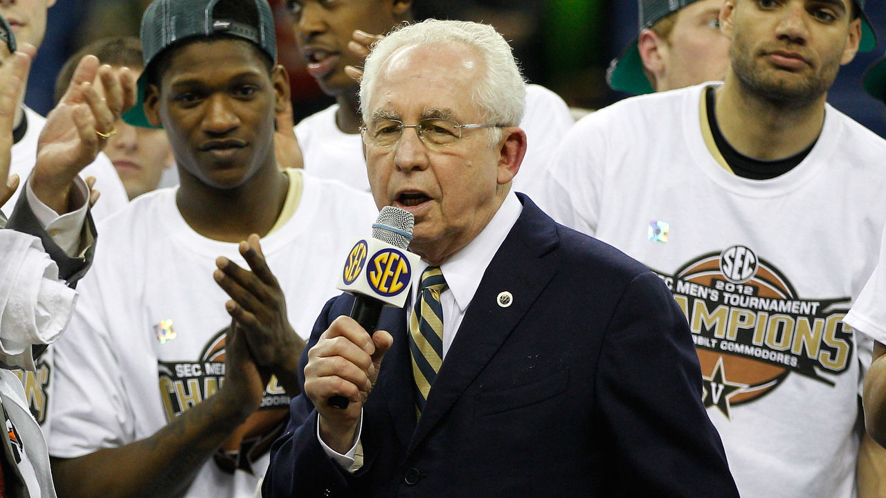 NEW ORLEANS, LA - MARCH 11: Southeastern Conference commissioner Mike Slive presents head coach Kevin Stallings of the Vanderbilt Commodores with the trophy after their 71 to 64 win over the Kentucky Wildcats in the championship game of the 2012 SEC Men's Basketball Tournament at New Orleans Arena on March 11, 2012 in New Orleans, Louisiana.