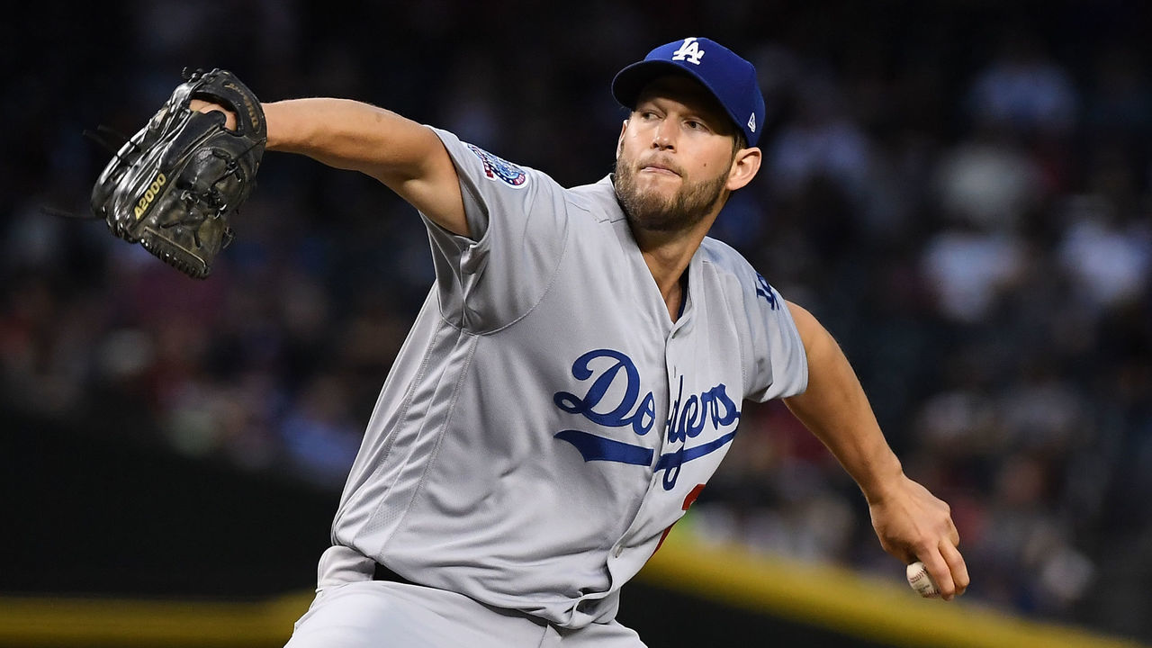 PHOENIX, AZ - APRIL 03: Clayton Kershaw #22 of the Los Angeles Dodgers delivers a first inning pitch against the Arizona Diamondbacks at Chase Field on April 3, 2018 in Phoenix, Arizona.