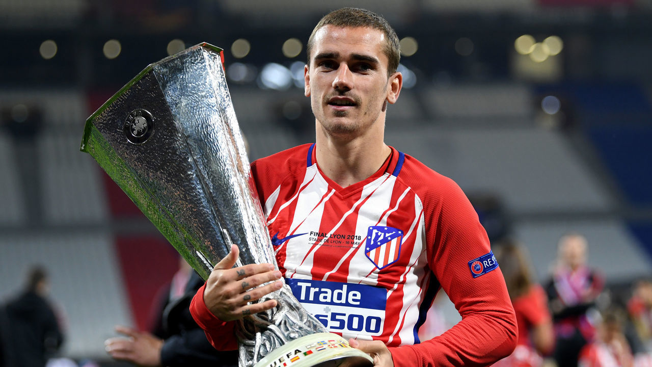 LYON, FRANCE - MAY 16: Antoine Griezmann of Atletico Madrid celebrates with the trophy following the UEFA Europa League Final between Olympique de Marseille and Club Atletico de Madrid at Stade de Lyon on May 16, 2018 in Lyon, France.