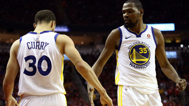 HOUSTON, TX - MAY 14: Kevin Durant #35 and Stephen Curry #30 of the Golden State Warriors react after a play in the third quarter against the Houston Rockets in Game One of the Western Conference Finals of the 2018 NBA Playoffs at Toyota Center on May 14, 2018 in Houston, Texas.