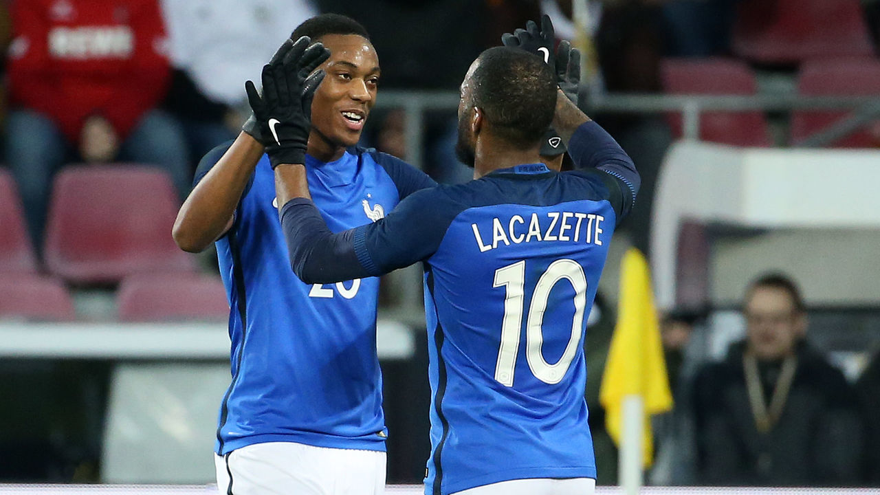 COLOGNE, GERMANY - NOVEMBER 14: Alexandre Lacazette of France celebrates his goal with Anthony Martial (left) during the international friendly match between Germany and France at RheinEnergieStadion on November 14, 2017 in Cologne, Germany.