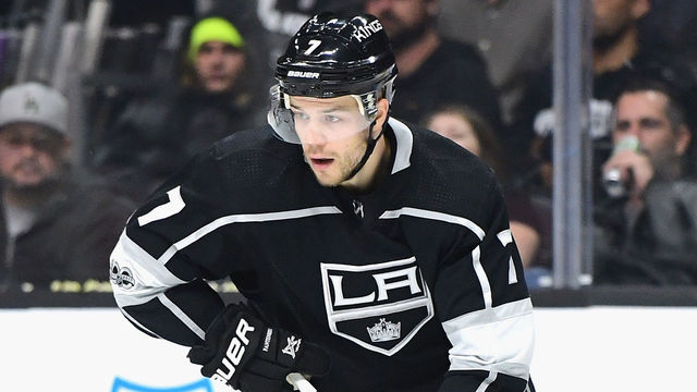 LOS ANGELES, CA - NOVEMBER 14: Oscar Fantenberg #7 of the Los Angeles Kings turns with the puck against the Vancouver Canucks at Staples Center on November 14, 2017 in Los Angeles, California.