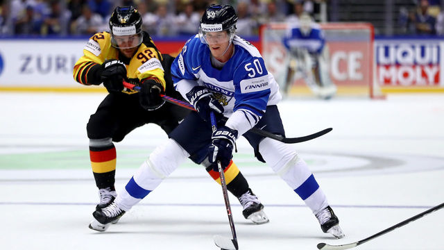 HERNING, DENMARK - MAY 13: Marcel Noebels (L) of Germany and Juuso Riikola of Finland battle for the puck during the 2018 IIHF Ice Hockey World Championship Group B game between Germany and Finland at Jyske Bank Boxen on May 13, 2018 in Herning, Denmark.
